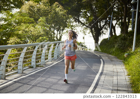 young asian woman running jogging outdoors young asian woman running jogging outdoors 122843313