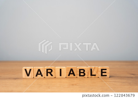 Wooden blocks with the word variable. Variability, variation, flexibility and change in business concept. 122843679