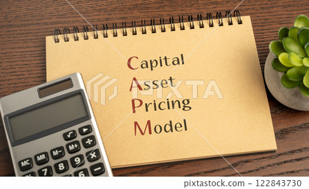 Capital asset pricing model concept. Financial model that calculates the expected return on an investment based on its risk relative to the market. Business and finance. CAPM word in notebook Capital asset pricing model concept. Financial model that calculates the expected return on an investment based on its risk relative to the market. Business and finance. CAPM word in notebook 122843730