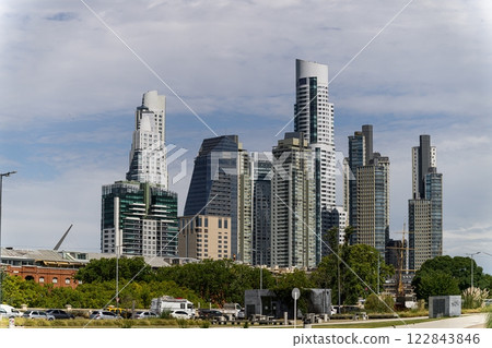 A city skyline that showcases a vast number of tall buildings 122843846