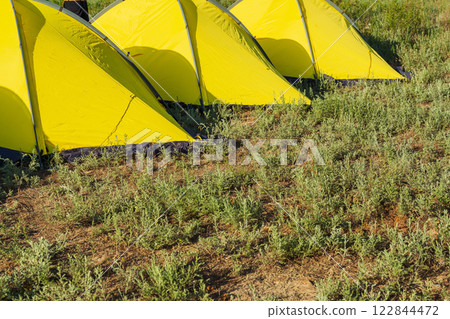 light green synthetic tourist tents in the field of Almaty. tents for sleeping on vacation light green synthetic tourist tents in the field of Almaty. tents for sleeping on vacation 122844472