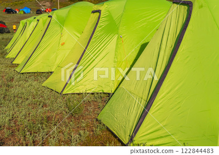 light green synthetic tourist tents in the field of Almaty. tents for sleeping on vacation 122844483