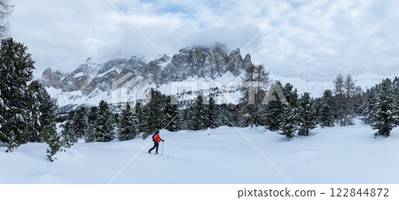 Backcountry Skier Walking in the scenic mountains in Dolomites, Panorama, italy Backcountry Skier Walking in the scenic mountains in Dolomites, Panorama, italy 122844872