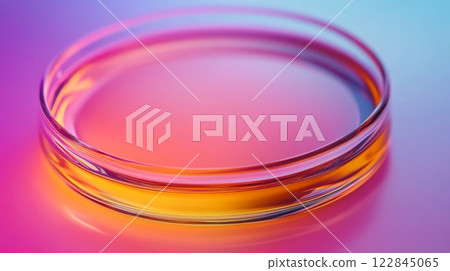 Petri dish with liquid reflecting vibrant pink, orange and blue colors Petri dish with liquid reflecting vibrant pink, orange and blue colors 122845065