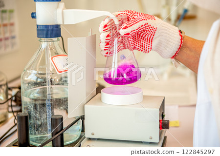 Laboratory equipment, titration of permanganate index. Manual titration station with brown bottle. 122845297