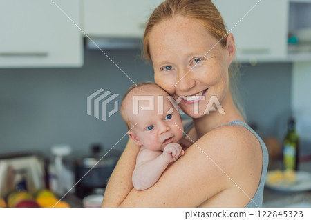 A mother lovingly embraces her newborn baby, holding them close to her chest. A tender moment of warmth, security, and deep maternal love, symbolizing bonding, comfort, and the unbreakable connection A mother lovingly embraces her newborn baby, holding them close to her chest. A tender moment of warmth, security, and deep maternal love, symbolizing bonding, comfort, and the unbreakable connection 122845323