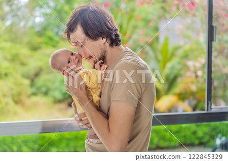A father gently embraces his newborn baby near a window, bathed in soft natural light. A heartwarming moment of love, protection, and deep connection, symbolizing the beauty of fatherhood and new A father gently embraces his newborn baby near a window, bathed in soft natural light. A heartwarming moment of love, protection, and deep connection, symbolizing the beauty of fatherhood and new 122845329