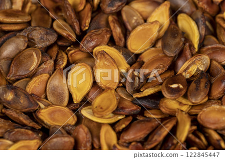ripe pumpkin seeds fried to brown and golden ripe pumpkin seeds fried to brown and golden 122845447