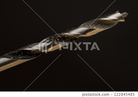 pine board that is drilled with steel drills 122845485