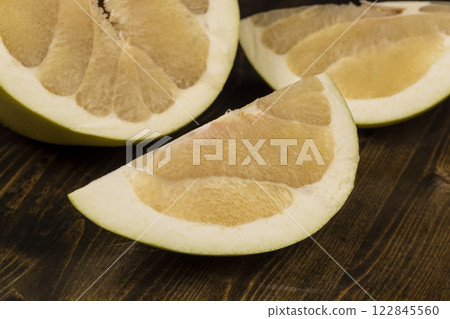 ripe pomelo with lots of pulp cut into pieces 122845560