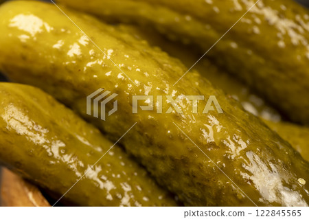 small, crispy green cucumbers salted with spices small, crispy green cucumbers salted with spices 122845565