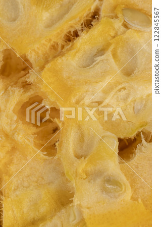 ripe orange pumpkin with seeds cut into pieces 122845567