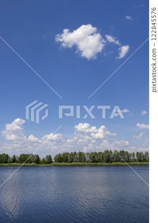 lake in summer in cloudy weather lake in summer in cloudy weather 122845576