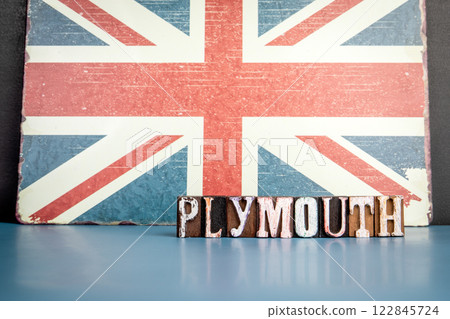 PLYMOUTH. Urban Area in Great Britain. Flag and alphabet letters on wooden texture background PLYMOUTH. Urban Area in Great Britain. Flag and alphabet letters on wooden texture background 122845724