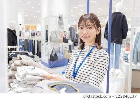 Woman working at an apparel store Woman working at an apparel store 122846137