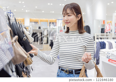 Shopping: A woman choosing shoes Shopping: A woman choosing shoes 122846180