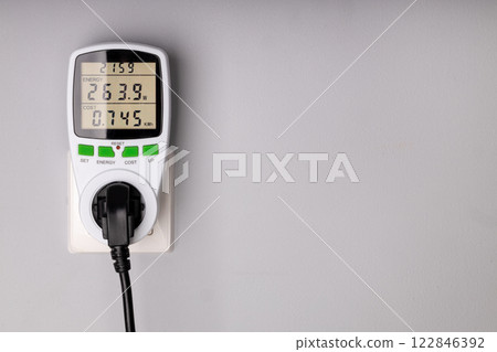 Energy Meter Measuring Power Consumption from Plugged in Device 122846392