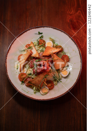 Caesar salad with bacon is mouthwatering and 122846442