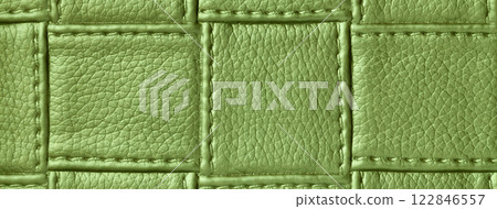Texture green leather background with square pattern and stitch, macro. Abstract olive backdrop from textile Texture green leather background with square pattern and stitch, macro. Abstract olive backdrop from textile 122846557