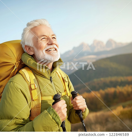Golden Sunlit Adventure, Year Old Retiree Hiking in Majestic Mountains Embracing Freedom 122846589