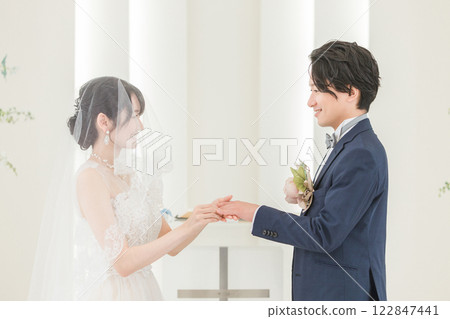 Bride and groom exchanging rings at the wedding hall (wedding, wedding, bridal) 122847441