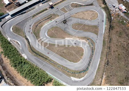 Distant drone capturing go-karts on winding tracks 122847533