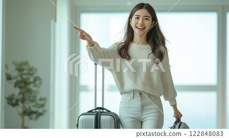A woman drawing a suitcase 122848083