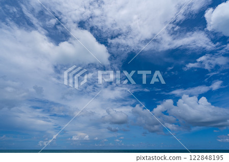 Beautiful blue sky white clouds over sea ocean background 122848195