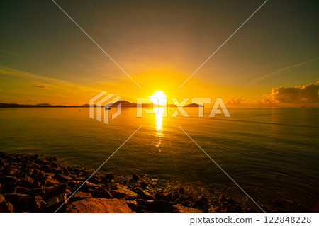 Landscape of colorful clouds in sunset or sunrise sky over sea with reflection in the tropical sea,Beautiful seascape scenery,Amazing light of nature Landscape nature background 122848228
