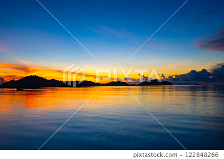 Landscape of colorful clouds in sunset or sunrise sky over sea with reflection in the tropical sea,Beautiful seascape scenery,Amazing light of nature Landscape nature background 122848266