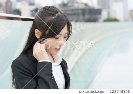 Depressed businesswoman at the Water Spaceship at OASIS21 in Sakae, Nagoya 122848508