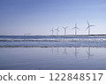 Blue sky and wind turbines lined up on the coast 122848517