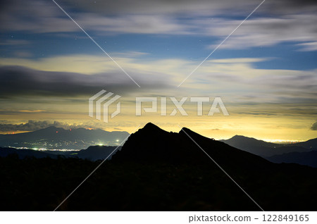 Clouds lit by moonlight and the silhouette of Mt. Tanigawa Mountain Range Clouds lit by moonlight and the silhouette of Mt. Tanigawa Mountain Range 122849165