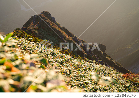 Mountainside dyed in the morning sun: Mountain scenery of the Tanigawa mountain range Mountainside dyed in the morning sun: Mountain scenery of the Tanigawa mountain range 122849170
