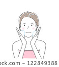 Smiling woman washing her face 122849388