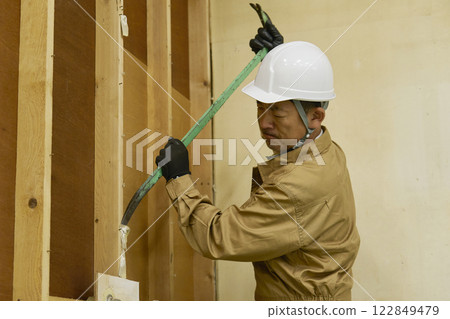 A male demolition worker working 122849479
