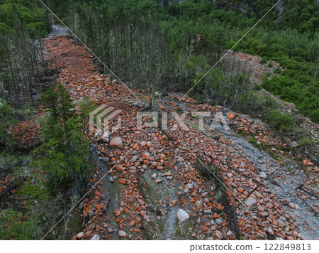 Aerial view of beautiful high altitude red mossed stone and forest landscape Aerial view of beautiful high altitude red mossed stone and forest landscape 122849813