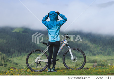 Woman riding mountain bike in forest mountain top 122849815