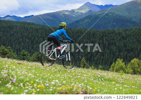 Riding mountain bike on beautiful forest mountain top 122849821