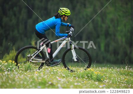 Riding mountain bike on beautiful forest mountain top 122849823