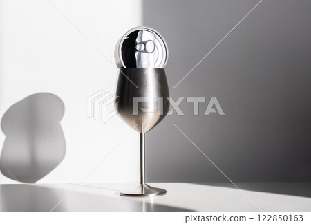 Stainless Steel Wine Glass with Tin Can in Harsh Light. Eco Conscious Still Life. 122850163