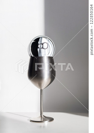 Stainless Steel Wine Glass with Tin Can in Harsh Light. Eco Conscious Still Life. 122850164