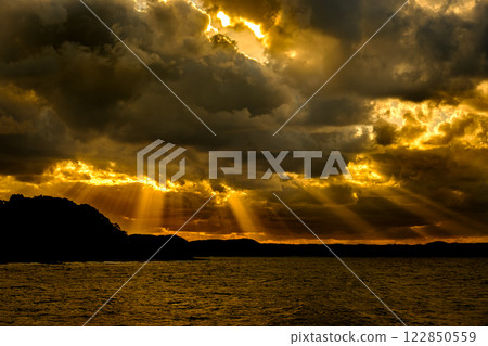 Sunset over the sea 122850559