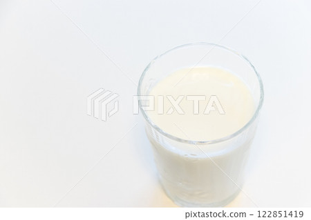 A glass filled with milk A glass filled with milk 122851419