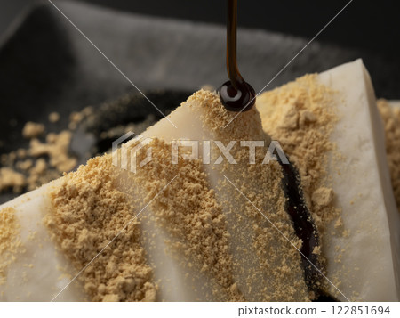 Kuzumochi Fermented food Kuzumochi topped with soybean flour and brown sugar syrup 122851694