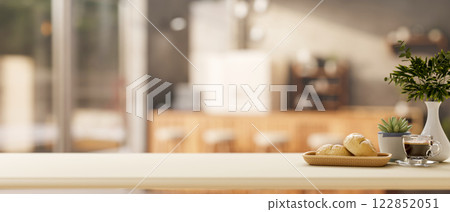 A minimalist white kitchen tabletop set in in a minimalist kitchen or coffee shop. 122852051