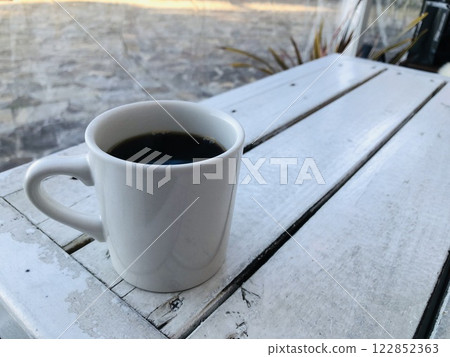 White table and black coffee White table and black coffee 122852363