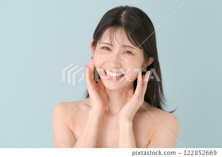 A woman checking her skin A woman checking her skin 122852669