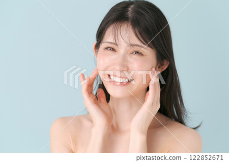 A woman checking her skin 122852671