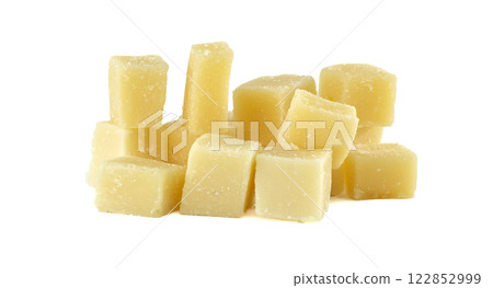 Parmesan cheese cubes forming a pile on white background 122852999